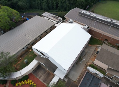 Aerial photo of a new commerical roof coating applied