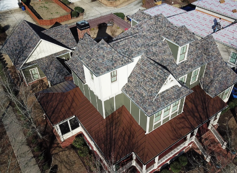 Cumming roofing image of a house with newly installed gray shingled roof