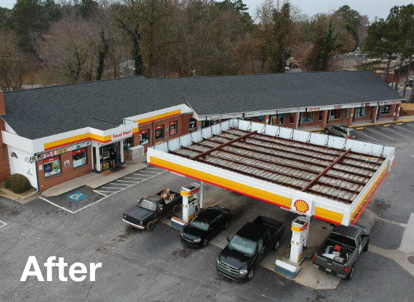 Photo of a shopping center with a gray asphalt roof after roof replacement