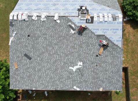 Overhead image of a residential roof in Douglasville Georgia being repaired after storm damages