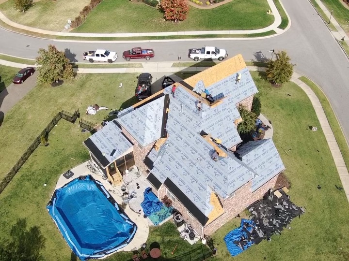 Photo of a Nashville brick home having its roof replaced