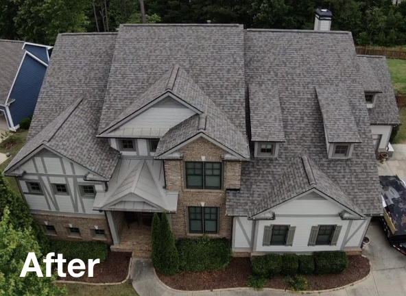 Photo of a gray asphalt residential roof on a house after roof replacement