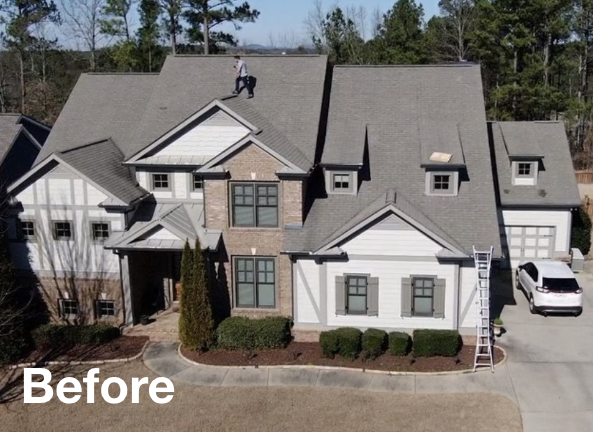 Photo of a gray asphalt residential roof on a house before roof replacement