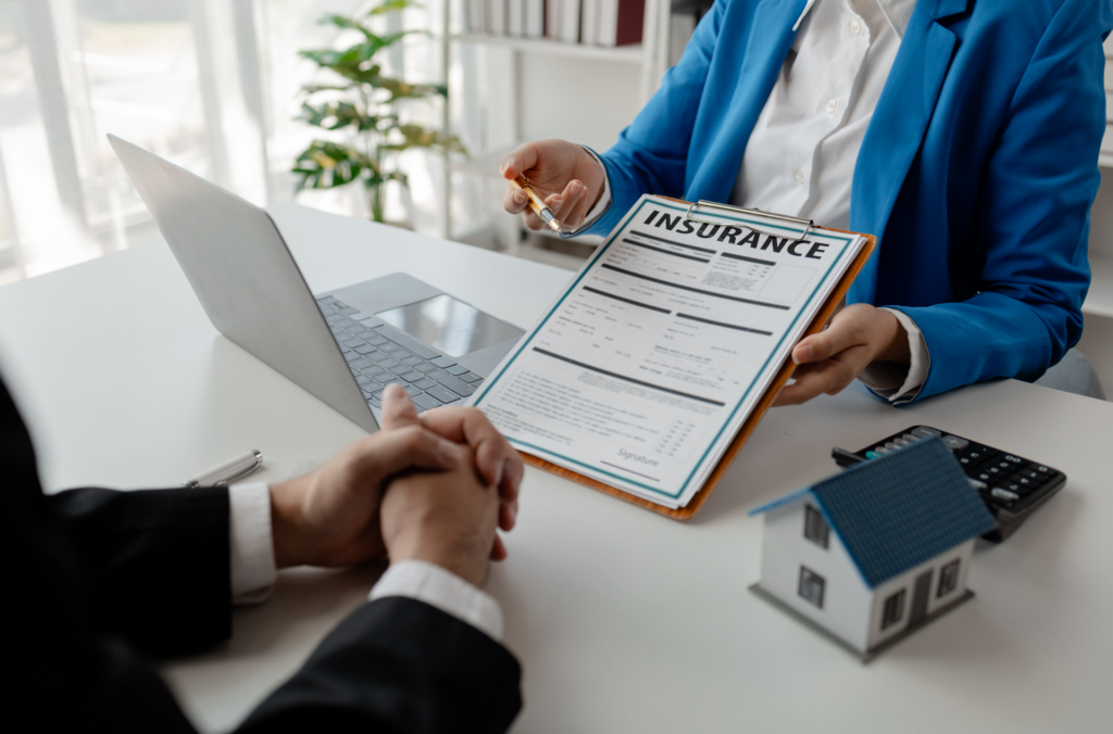 Image of an insurance agent showing a form for insurance claims for roof damage.