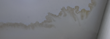 Image of a roof leak stain on roof