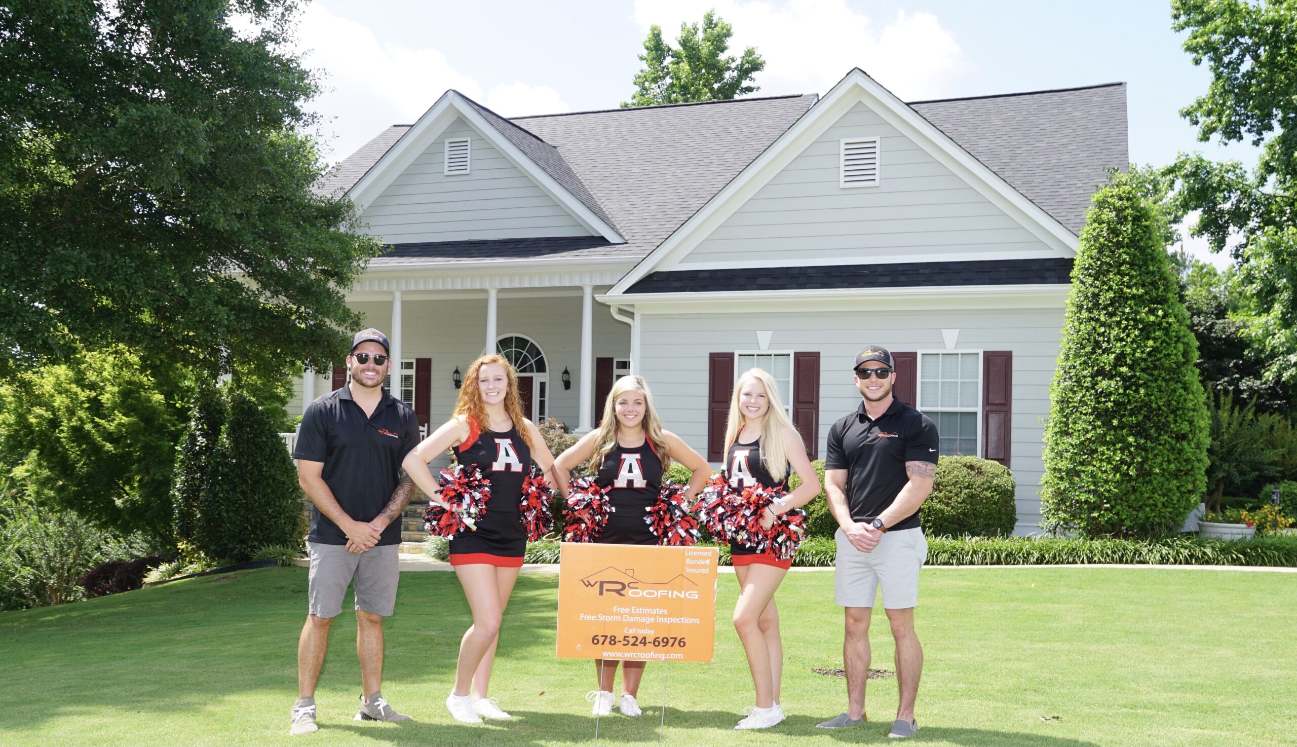 Roofing in Douglasville image of cheerleaders in front of a white house with a new roof