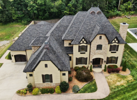 Nashville roofing Image of a brick house with newly installed gray shingled roof