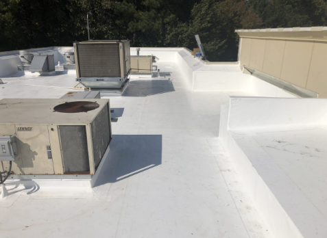 Image of white single ply roofing applied to a commercial roof