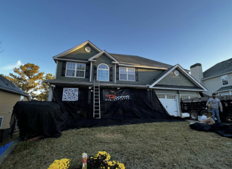 Image of Whitaker Roofing crew repairing roof