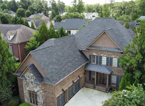 Image of a residential roof in Kennesaw Georgia with newly replaced shingles