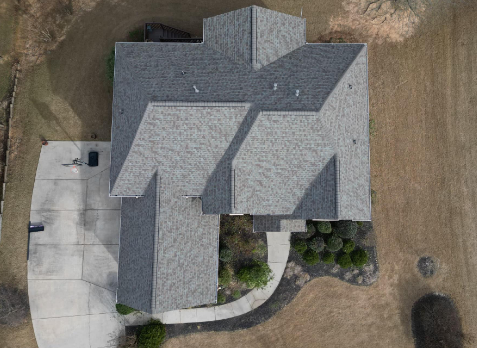 Roswell roofing image of a white house with newly installed gray shingled roof