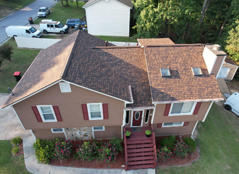 Image of a house with newly installed brown shingled roof in Trussville Alabama