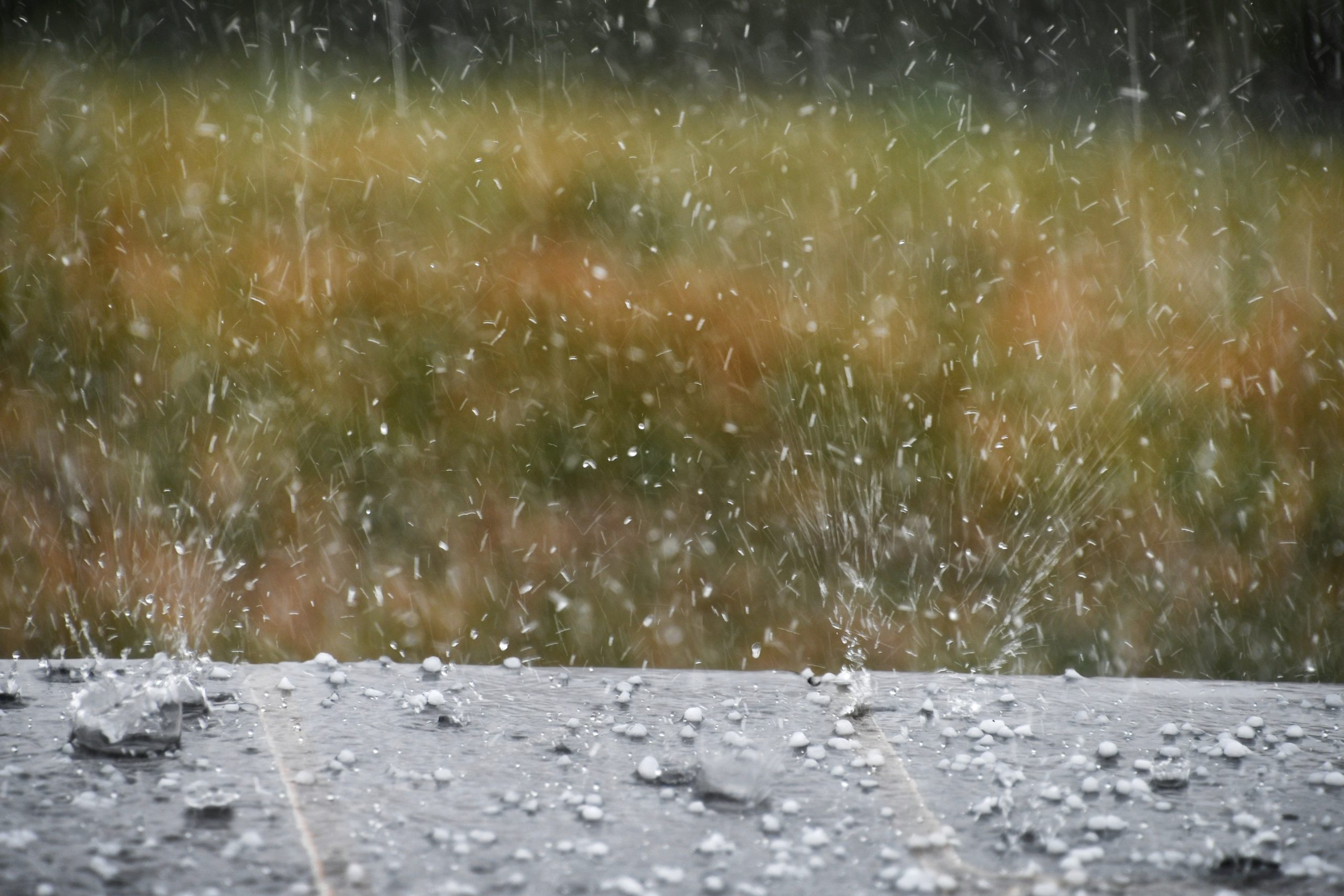 Hail damage being done on roof from hailstones during a hailstorm