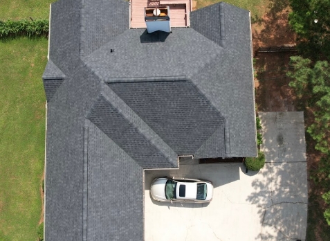 Overhead Image of a house with newly replaced gray shingled roof after a roof repair in Newnan Georgia