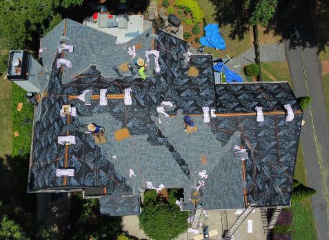 Overhead image of a residential roof in Augusta Georgia being repaired after storm damages