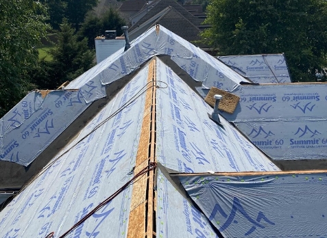 Image of a house with a roof being replaced in Newnan Georgia