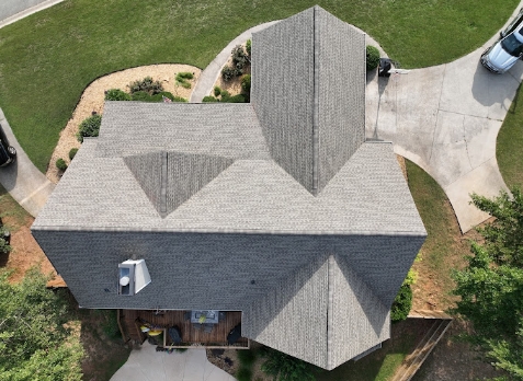 Overhead Image of a house with newly replaced gray shingled roof after a roof repair in Sharpsburg Georgia