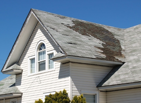 Image of a residential roof in Sharpsburg Georgia with storm damages