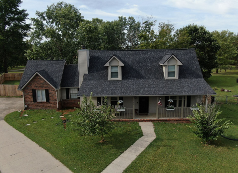 Overhead Image of brick house with a new shingle roof