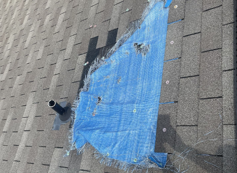 Image of a residential roof in Brentwood Tennessee with storm damages