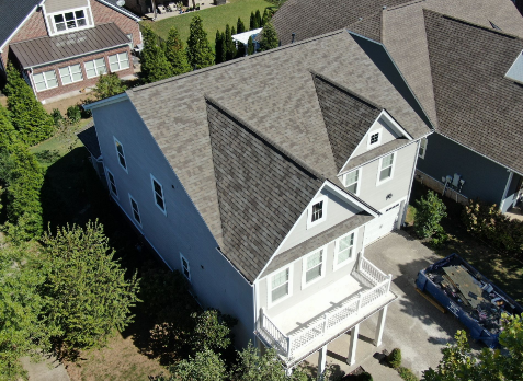 Clarksville roofing Image of a gray house with newly installed gray shingled roof