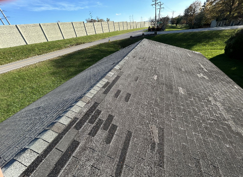 Image of a residential roof in Clarksville Tennessee with storm damages