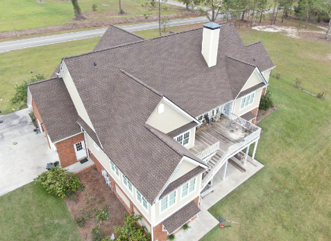 Overhead Image of brick house with a new shingle roof