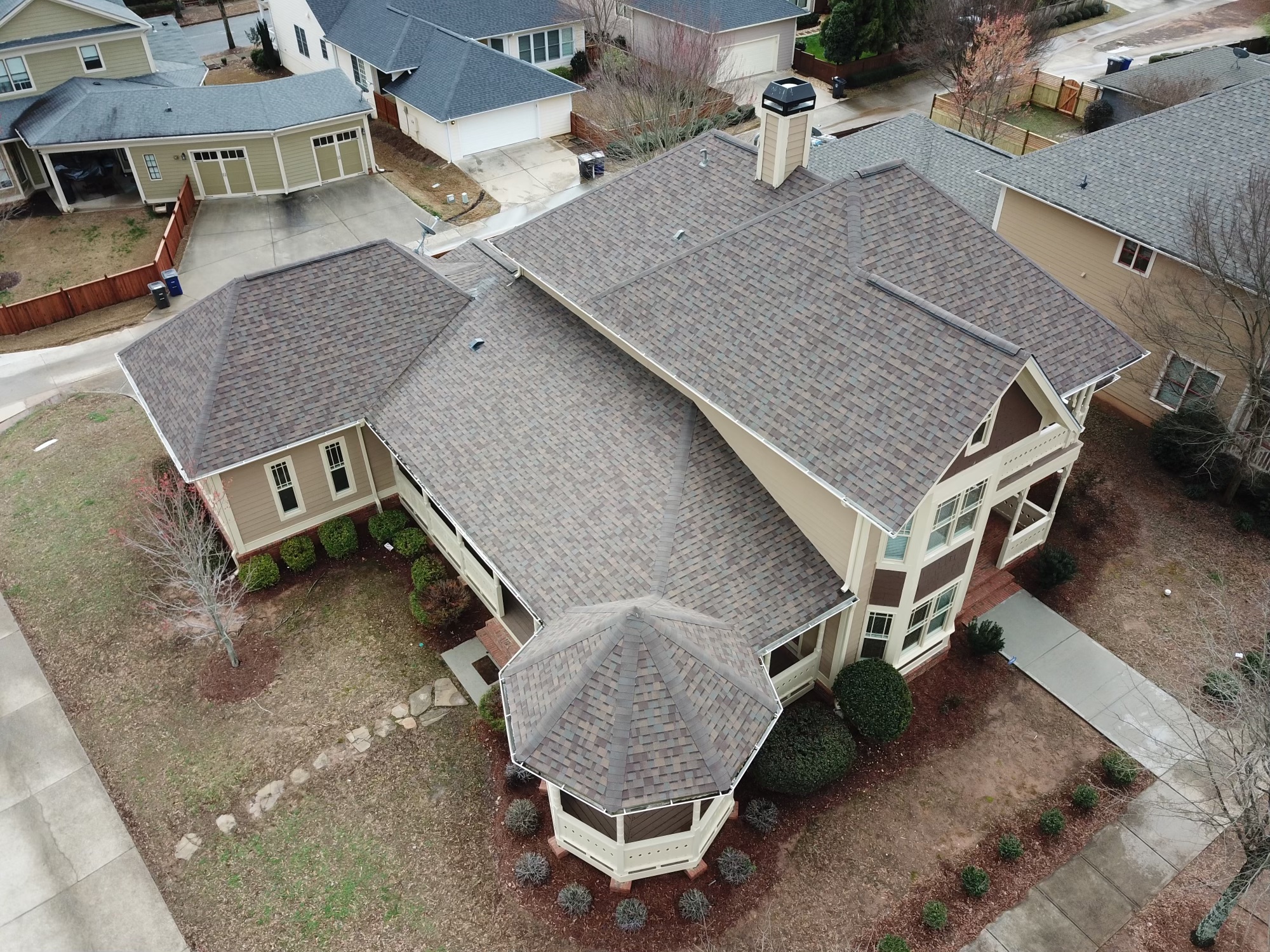 Overhead Image of gray shingle roofing on large house