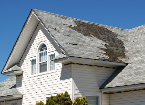 Image of a residential roof in Vidalia Georgia with storm damages