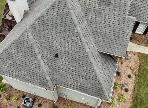 Carrollton roofing Image of a house with newly installed gray shingled roof