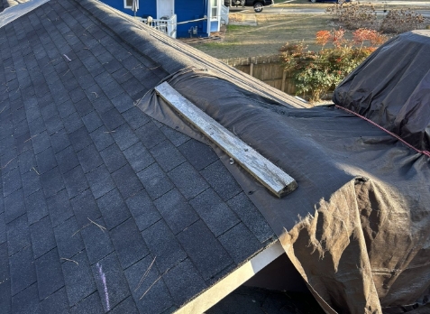 Image of a residential roof in Carrollton Georgia with storm damages