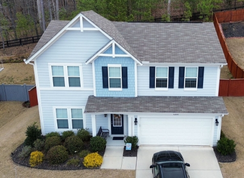 Image of blue residential house with a new shingle roof in Lawrenceville