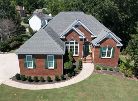 Image of a house with newly installed gray shingled roof in Lawrenceville Georgia