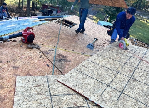 Overhead image of a residential roof in Lawrenceville Georgia being repaired after storm damages