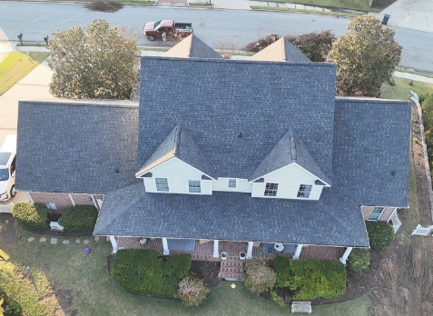 Image of white residential house with a new shingle roof in Martinez