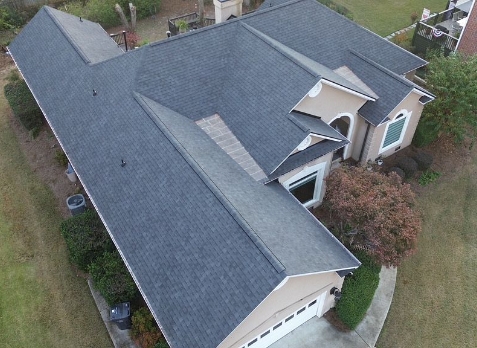 Image of a house with newly installed gray shingled roof in Martinez Georgia