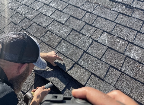 Image of a residential shingle roof during roof inspection