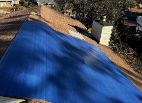 Roof repair needed after some damaged shingles on a house in Martinez