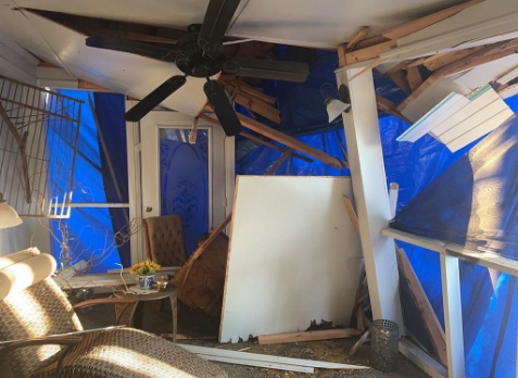 Image of a residential roof in Martinez Georgia with storm damages