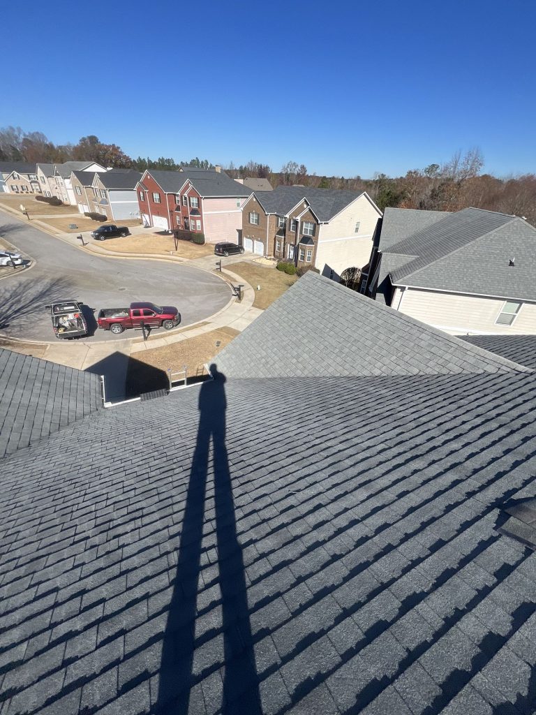 Image of a residential shingle roof during roof maintenance