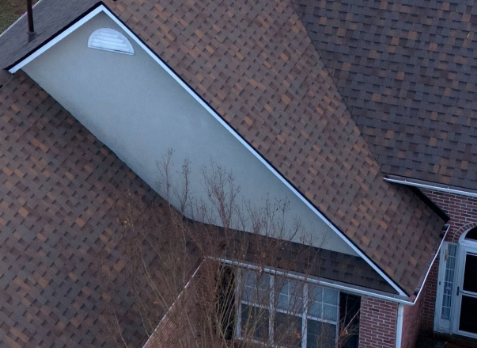 Image of a house with newly installed brown shingled roof in Fayetteville Georgia