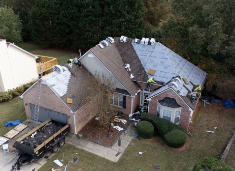 Photo of a Fayetteville home during a roof replacement