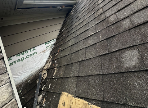 Upclose image of a residential roof in Fayetteville Georgia after storm damages