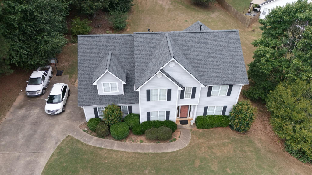 New roof on a white house after roof financing