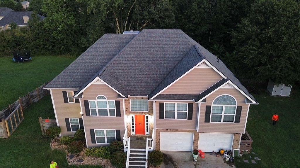 image of Local roofing company new roof replacement on a residential home with gray shingles