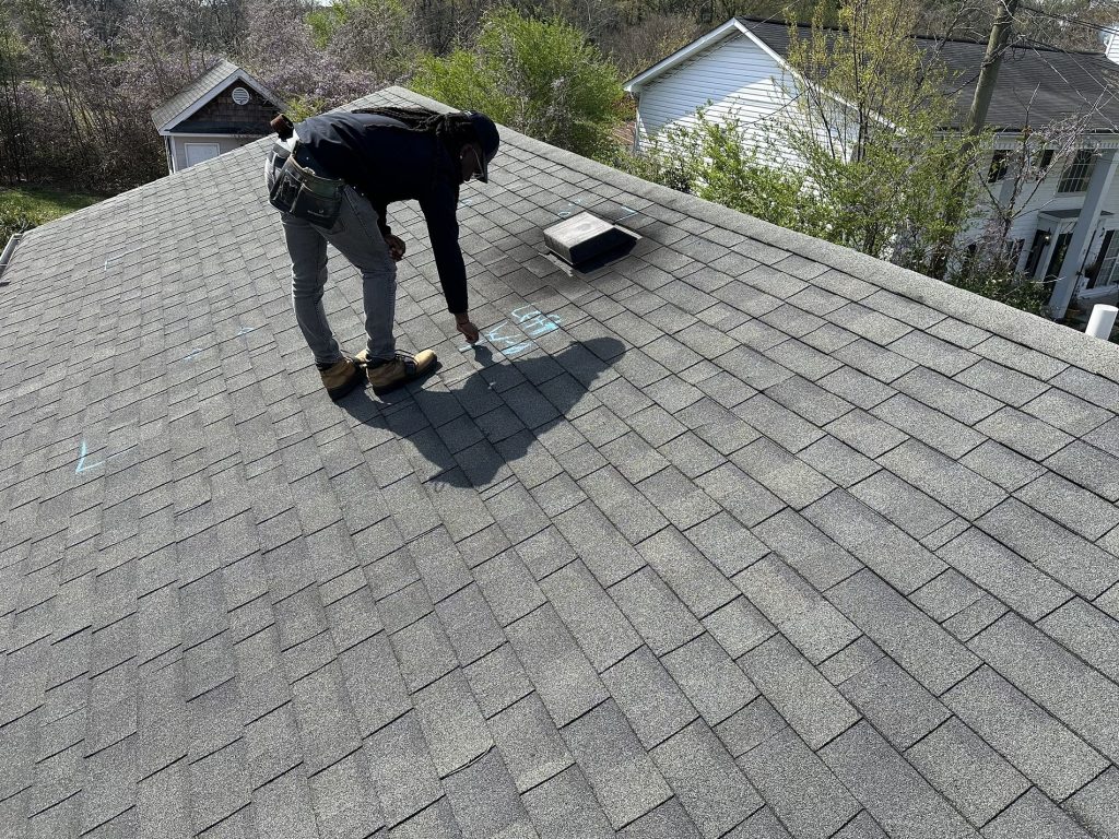 image of Local roofing company inspecting a roof