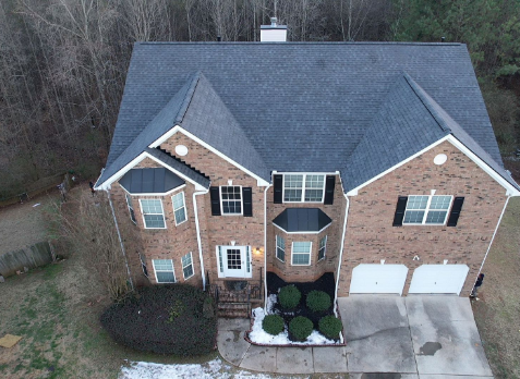 Image of brick residential house with a new shingle roof in Villa Rica