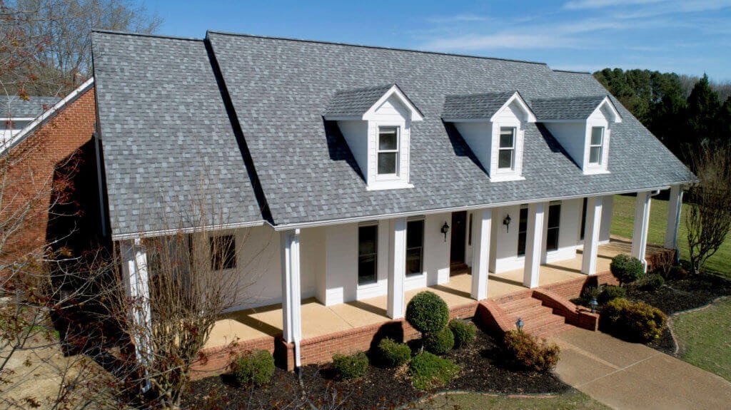 White house with gray architectural shingles