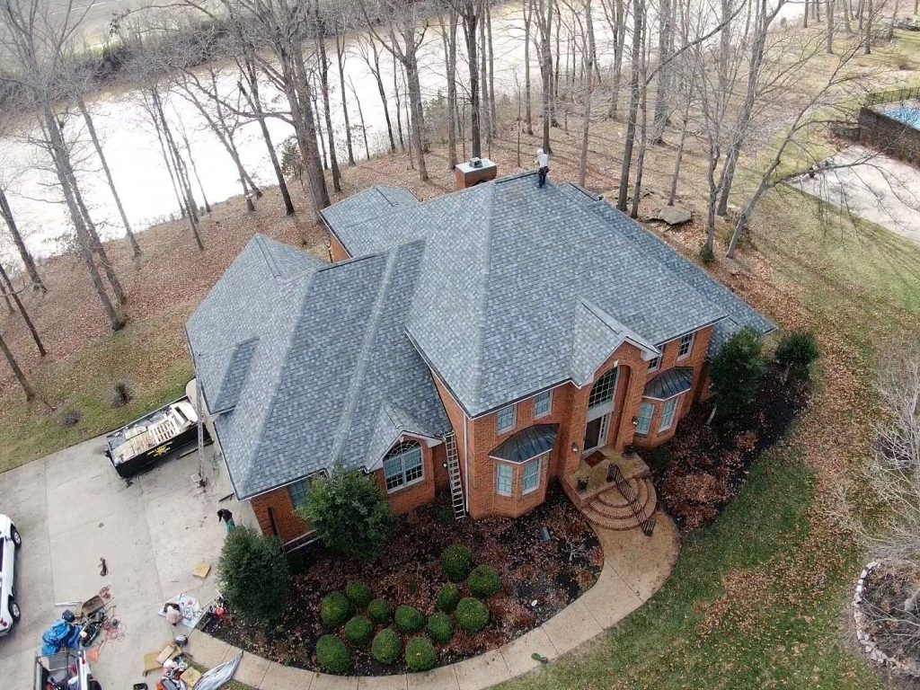 Nashville roofing Image of a brick house with newly installed gray shingled roof