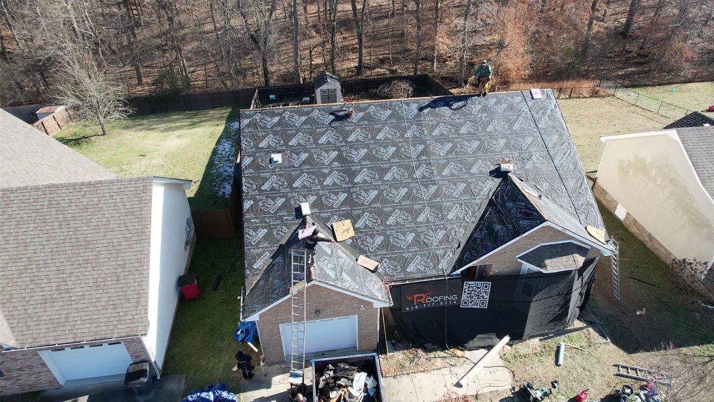 Photo of a Nashville brick home having its roof replaced